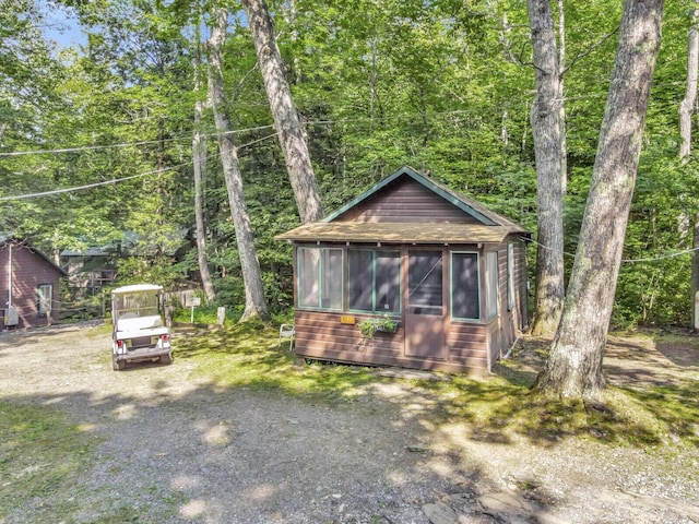103 Taylor Woods Rd, Belgrade, ME 04917 - rustic home with a sunroom