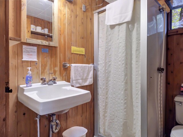 103 Taylor Woods Rd, Belgrade, ME 04917 - bathroom with wood walls and a shower stall