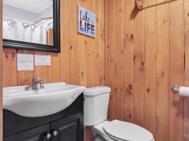 103 Taylor Woods Rd, Belgrade, ME 04917 - bathroom featuring vanity, wooden walls, and a shower with shower curtain