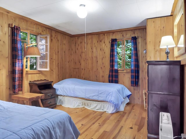 103 Taylor Woods Rd, Belgrade, ME 04917 - bedroom featuring wood walls and wood finished floors