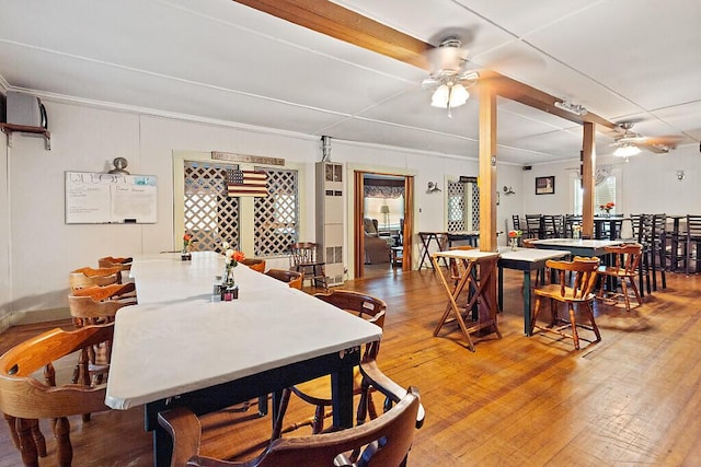 103 Taylor Woods Rd, Belgrade, ME 04917 - dining area featuring a ceiling fan, wood finished floors, and crown molding