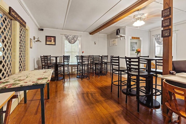 103 Taylor Woods Rd, Belgrade, ME 04917 - dining area with wood-type flooring, a ceiling fan, crown molding, and beamed ceiling