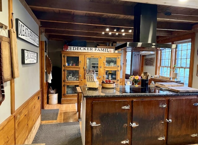 2103 US Highway 1, Sullivan, ME 04664 - bar with black electric cooktop, island range hood, carpet flooring, wood ceiling with exposed beams, and wainscoting