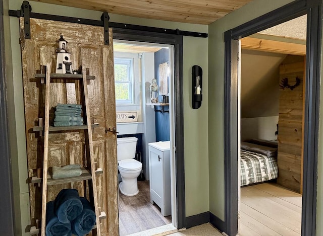 2103 US Highway 1, Sullivan, ME 04664 - bathroom featuring toilet, wood finished floors, and wooden ceiling