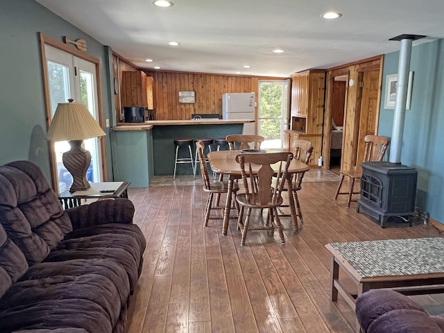 861 W Shore Rd, Otis, ME 04605 - dining space with recessed lighting, hardwood / wood-style floors, and a wood stove