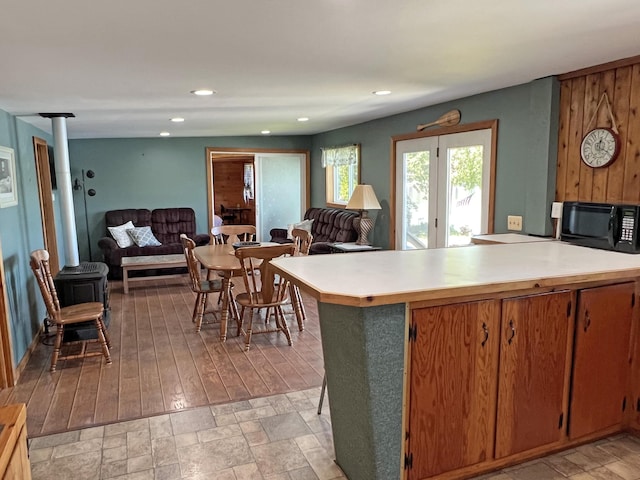861 W Shore Rd, Otis, ME 04605 - kitchen featuring black microwave, light countertops, open floor plan, a peninsula, and recessed lighting