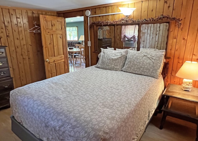 861 W Shore Rd, Otis, ME 04605 - bedroom with wooden walls and wood finished floors