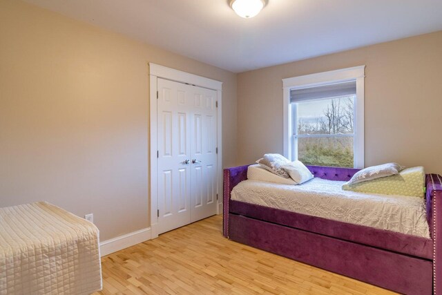 231 Parkway S, Brewer, ME 04412 - bedroom featuring light wood-style flooring, a closet, and baseboards