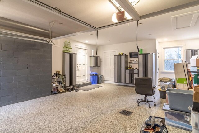 231 Parkway S, Brewer, ME 04412 - garage with a garage door opener and concrete block wall