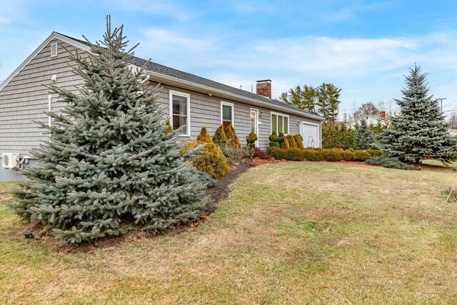 231 Parkway S, Brewer, ME 04412 - view of front of home with a chimney, a garage, and a front lawn