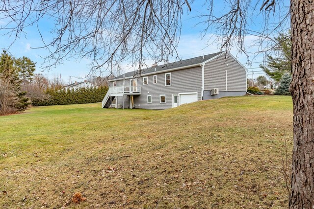 231 Parkway S, Brewer, ME 04412 - rear view of house featuring stairs, an attached garage, a yard, and a deck