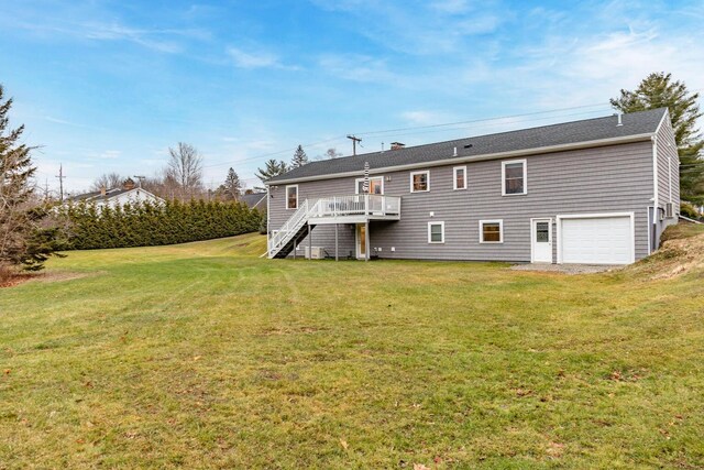 231 Parkway S, Brewer, ME 04412 - back of property featuring stairway, a wooden deck, an attached garage, and a lawn