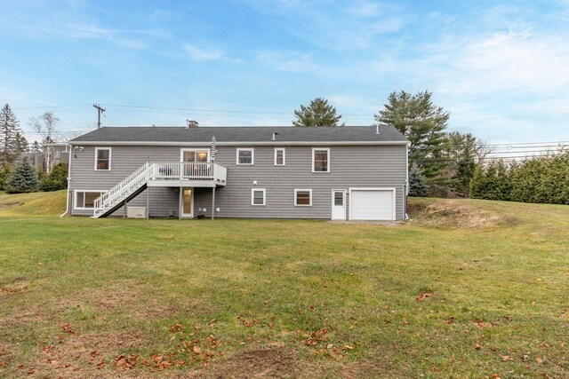 231 Parkway S, Brewer, ME 04412 - rear view of property with stairs, an attached garage, a deck, and a lawn