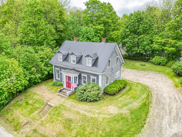 44 Neal St, Gardiner, ME 04345 - new england style home with a chimney, dirt driveway, metal roof, and a standing seam roof