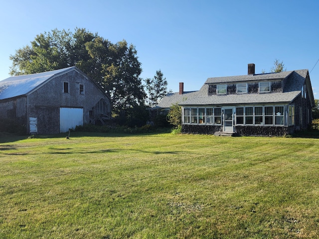 1542 Moosehead Trail Highway, Plymouth, ME 04969 - view of grassy yard featuring a sunroom and an outbuilding