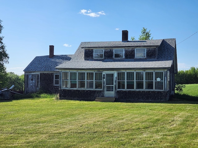 1542 Moosehead Trail Highway, Plymouth, ME 04969 - rear view of house featuring a chimney, a yard, and a shingled roof