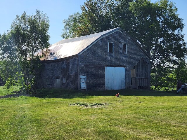 1542 Moosehead Trail Highway, Plymouth, ME 04969 - view of side of home featuring a barn, a lawn, and an outdoor structure