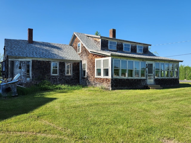 1542 Moosehead Trail Highway, Plymouth, ME 04969 - back of house featuring a chimney, a yard, and roof with shingles