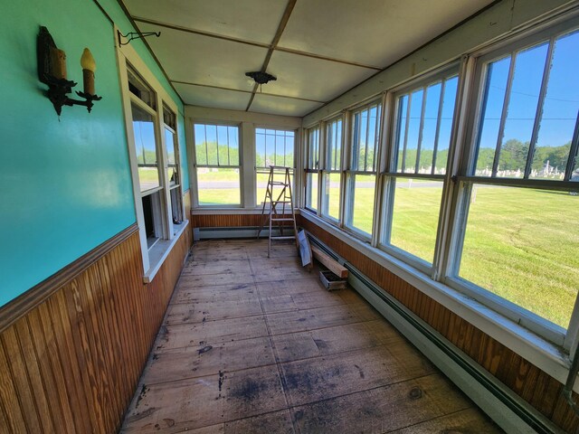 1542 Moosehead Trail Highway, Plymouth, ME 04969 - unfurnished sunroom featuring a baseboard radiator, baseboard heating, and plenty of natural light