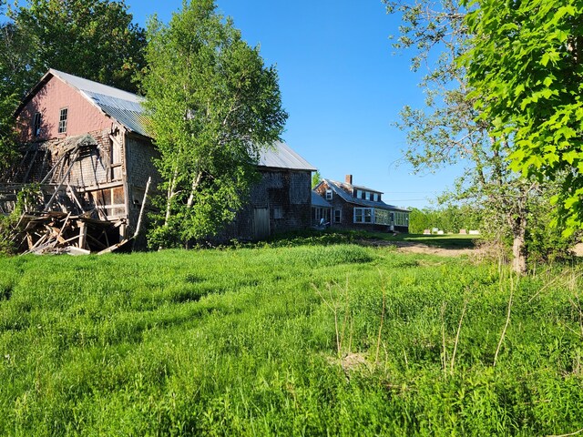 1542 Moosehead Trail Highway, Plymouth, ME 04969 - view of yard with an outdoor structure and a barn