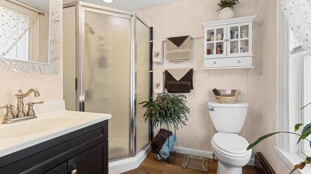 151 Birch St Unit A, B, Bangor, ME 04401 - full bath with a shower stall, vanity, toilet, wood finished floors, and baseboards