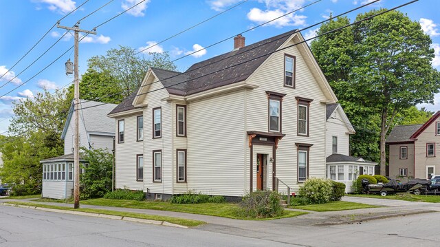 151 Birch St Unit A, B, Bangor, ME 04401 - view of front of house featuring roof with shingles and a chimney