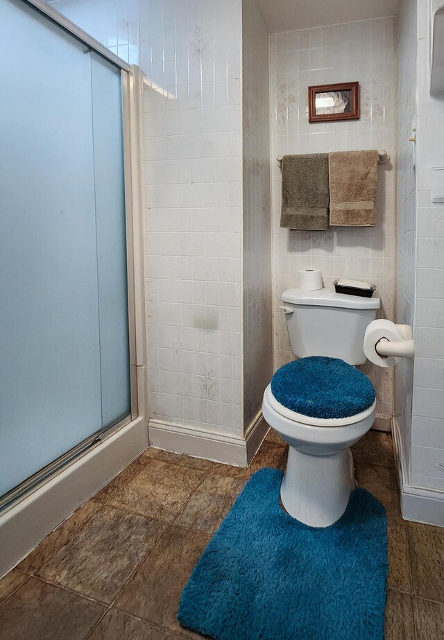 151 Birch St Unit A, B, Bangor, ME 04401 - full bathroom with a stall shower, toilet, and tile walls