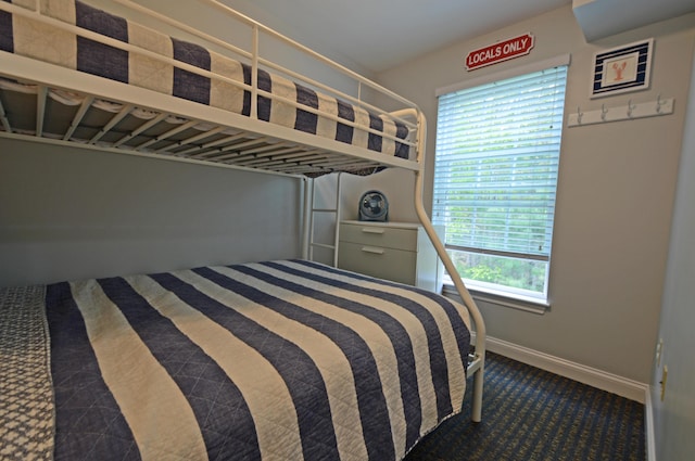 272 Mills Rd Unit 7C, Kennebunkport, ME 04046 - bedroom with baseboards and dark carpet