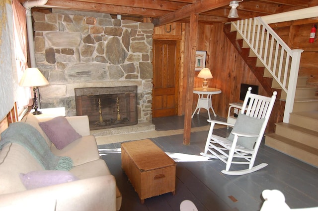 14 Auditorium Park, Northport, ME 04849 - living area featuring stairs, wooden walls, and a fireplace