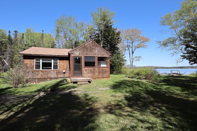 50 Hook Ln, Frenchtown Twp, ME 04441 - view of front of house featuring a front yard and a water view