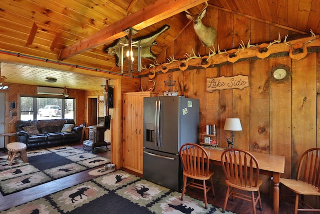 50 Hook Ln, Frenchtown Twp, ME 04441 - kitchen featuring stainless steel fridge with ice dispenser, wood walls, wood ceiling with exposed beams, a chandelier, and high vaulted ceiling
