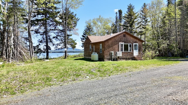 50 Hook Ln, Frenchtown Twp, ME 04441 - view of home's exterior with a water view and a lawn