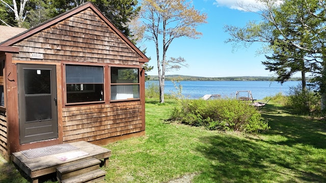 50 Hook Ln, Frenchtown Twp, ME 04441 - view of grassy yard with a water view and an outbuilding