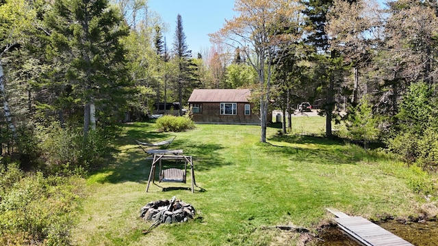 50 Hook Ln, Frenchtown Twp, ME 04441 - view of green lawn with a fire pit