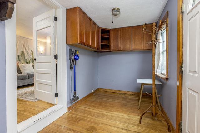 52 Pleasant St, North Berwick, ME 03906 - washroom with light wood-style floors and baseboards