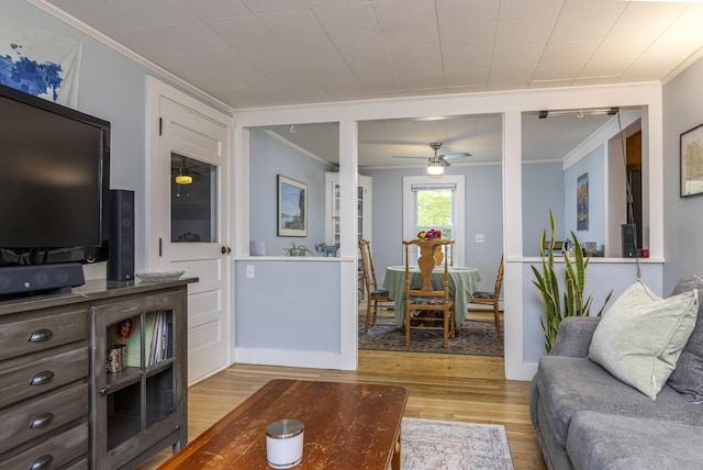 52 Pleasant St, North Berwick, ME 03906 - living area with ornamental molding, wood finished floors, and a ceiling fan