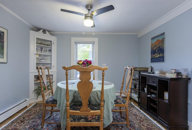 52 Pleasant St, North Berwick, ME 03906 - dining space with a baseboard radiator, a ceiling fan, and ornamental molding