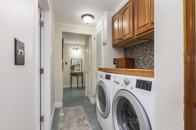 52 Pleasant St, North Berwick, ME 03906 - laundry area featuring independent washer and dryer, dark tile patterned floors, cabinet space, ornamental molding, and baseboards