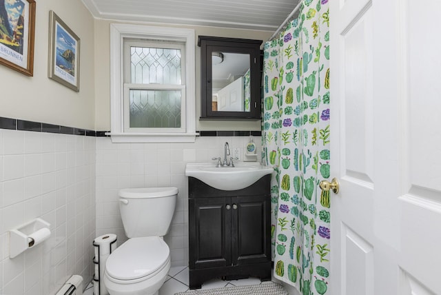 52 Pleasant St, North Berwick, ME 03906 - full bathroom featuring vanity, toilet, tile walls, and a baseboard radiator