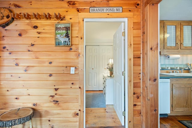 18 Scenic View Dr, Naples, ME 04055 - hallway featuring light wood-style flooring, a sink, and log walls