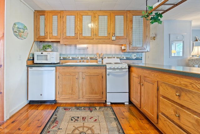 18 Scenic View Dr, Naples, ME 04055 - kitchen with white appliances, a sink, light wood-style floors, and brown cabinetry