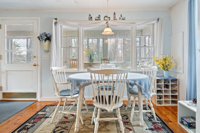 18 Scenic View Dr, Naples, ME 04055 - dining space with wood-type flooring and crown molding