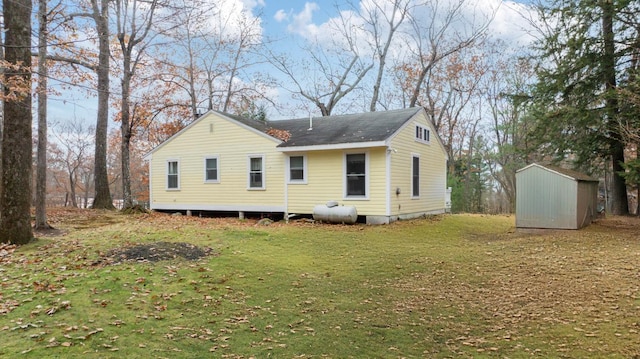 18 Scenic View Dr, Naples, ME 04055 - back of house with a lawn and a shingled roof