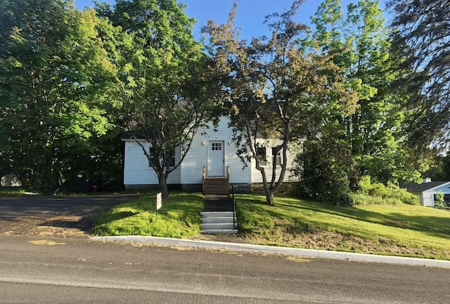 14 Highland Ave, Augusta, ME 04330 - view of property hidden behind natural elements with entry steps and a front yard