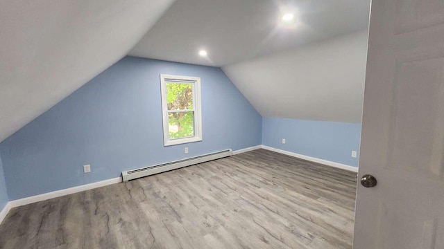 14 Highland Ave, Augusta, ME 04330 - additional living space featuring baseboard heating, wood finished floors, baseboards, and vaulted ceiling