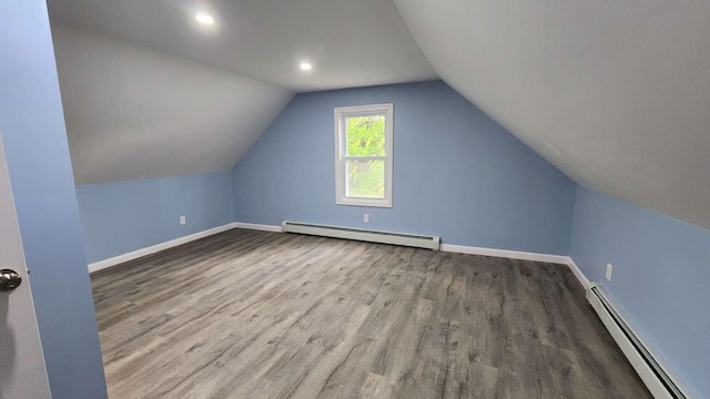 14 Highland Ave, Augusta, ME 04330 - additional living space with a baseboard radiator, wood finished floors, baseboards, and vaulted ceiling