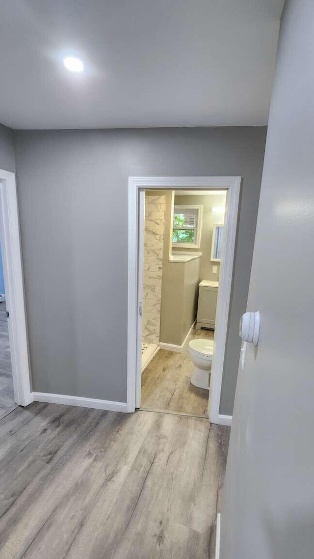 14 Highland Ave, Augusta, ME 04330 - bathroom featuring toilet, wood finished floors, and baseboards