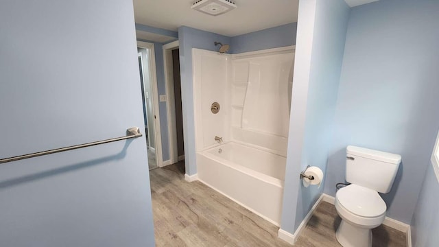 14 Highland Ave, Augusta, ME 04330 - full bath with wood finished floors, toilet, tub / shower combination, and baseboards