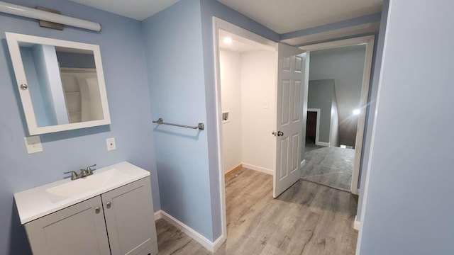 14 Highland Ave, Augusta, ME 04330 - bathroom featuring wood finished floors, vanity, and baseboards
