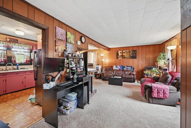 383 Main St, Pittsfield, ME 04967 - living area with wooden walls and light carpet